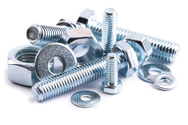 nuts and bolts pile of steel nuts and bolts on white backgroundsee my nut fastener stock pictures, royalty-free photos & images