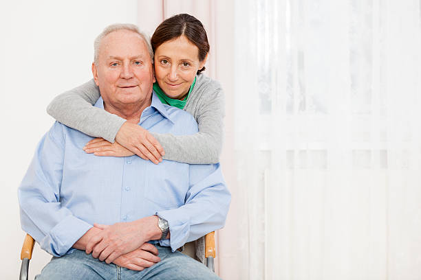 istock Senior man with caregiver 172468843