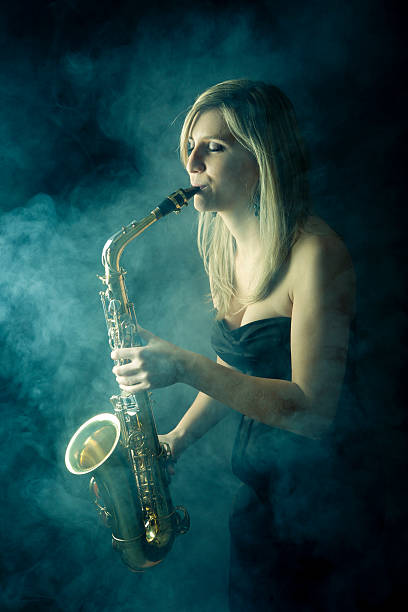 istock Beautiful woman playing saxophone 172468914