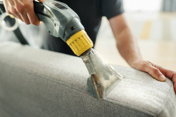 Furniture deep cleaning. Closeup top view of unrecognizable man performing deep clean of sofa cushions. deep cleaning services stock pictures, royalty-free photos & images