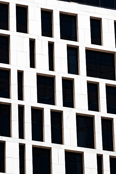 istock Closeup modern white office building with black windows 172469207