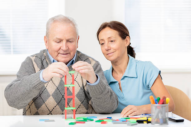 istock Senior man with wooden block 172469312