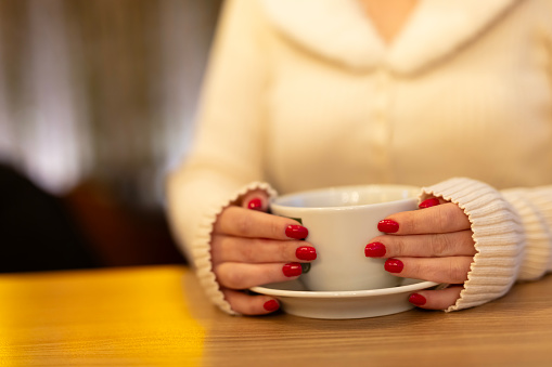 Coffee Cup, Lady's hands holding Coffee Cup, Woman holding a white mug