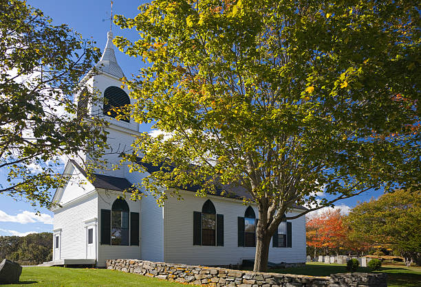 istock Small white church in Maine with autumn colored trees 172469938
