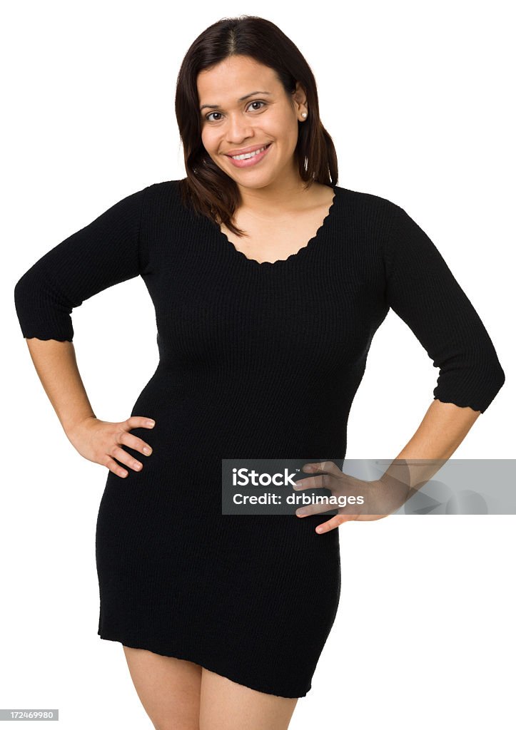 Donna sorridente in posa, le mani sui fianchi - Foto stock royalty-free di Donne