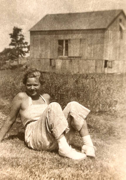 istock Young Woman and Barn 1930s 1724702059