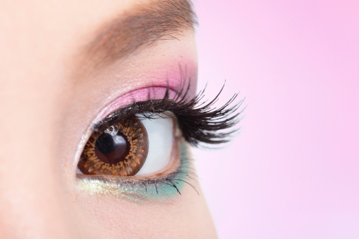 Close up of colorful eyeshadow. Eyes Makeup. pink and green color, asian beauty, spring and summer makeup concept