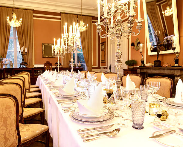 istock A luxury banquet table laid with silver cutlery in a room 172470453
