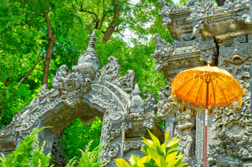 Detail of a Hindu Temple in Bali - Indonesia. With the typical small umbrellas. 