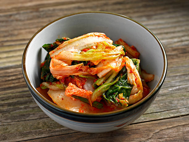 Kimchi Kimchi in a Bowl. cayenne powder photos stock pictures, royalty-free photos & images