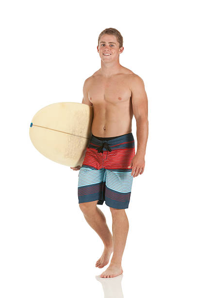 счастливый человек, проведение доска для серфинга - swimming shorts surfing male full length стоковые фото и изображения
