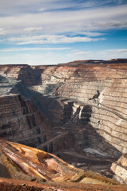 Gold Mine in Kalgoorlie "Vertical shot for the Super Pit, Australia's largest open cut gold mine." gold mine stock pictures, royalty-free photos & images