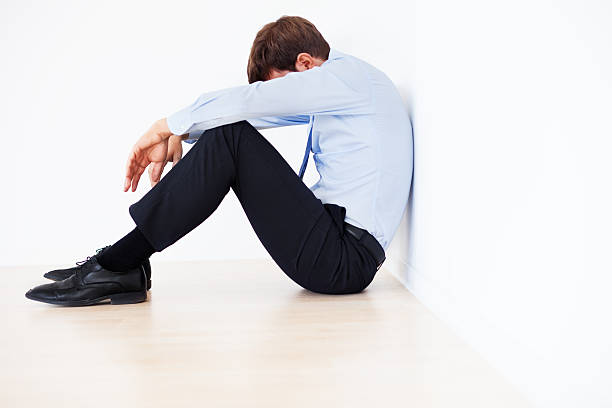 istock Exhausted Businessman Sitting on the Floor 172473423
