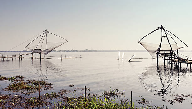 Chinese fishing nets Traditional Chinese fishing nets near Cochin,Kerala,India. cochin kerala india chinese fishing net stock pictures, royalty-free photos & images