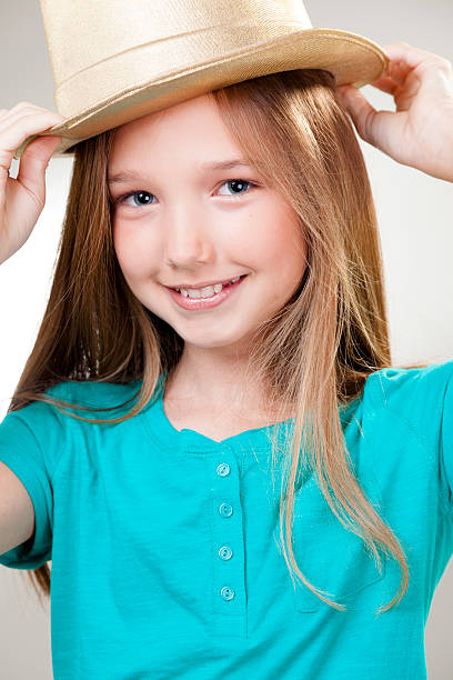 istock Children:  Elementary age girl with gold top hat 172473538