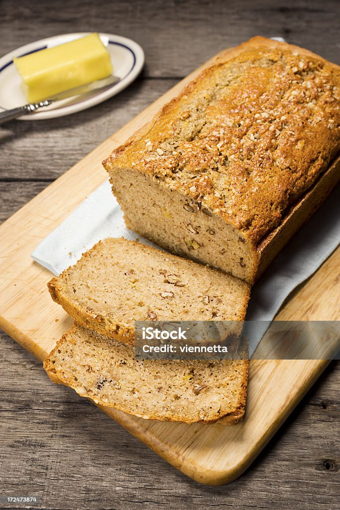 Banana Nut Bread Cut Into Slices Slices have been cut from a homemade loaf of banana nut bread. Baked Stock Photo