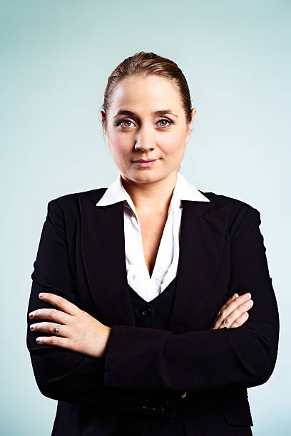 istock Confident young businesswoman smiles challengingly with arms folded 172474143