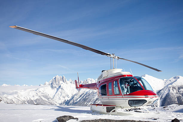 istock Red Helicopter on a Mountain in Winter 172474649