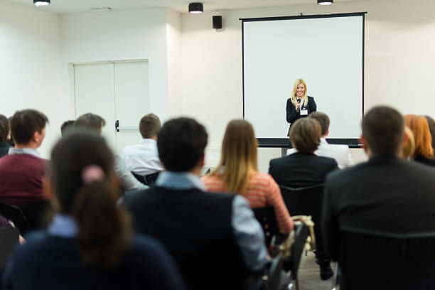 istock Young businesswoman with microphone 172474718