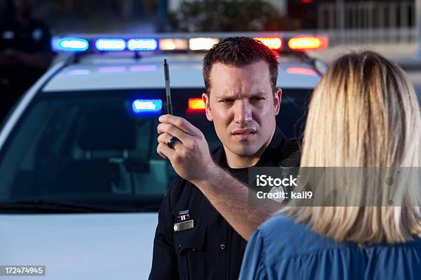 Police Officer Conducting Sobriety Test Stock Photo - Download Image Now - Sobriety Test, Drunk Driving, Police Force