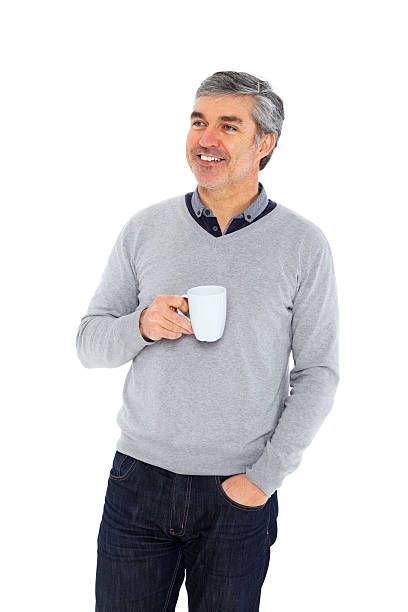 istock Relaxed mature man holding a cup of coffee looking away 172476146