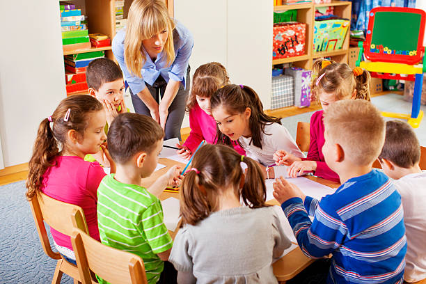 istock Teacher drawing with children. 172476370