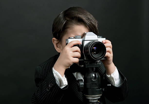 istock Little boy taking pictures 172476675