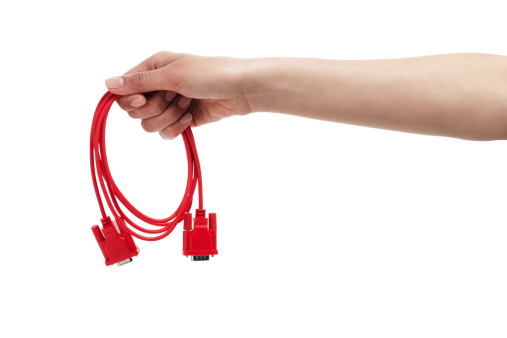 Beautiful female hand holding red computer cable. XXXL