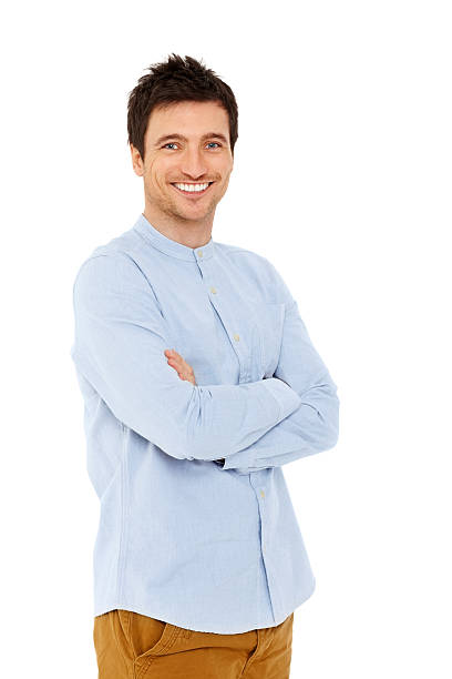 istock Happy young man standing with his arms crossed against white 172477163