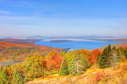 Height of Land has an outstanding panoramic view of Mooselookmeguntic Lake with the White Mountains in the background.