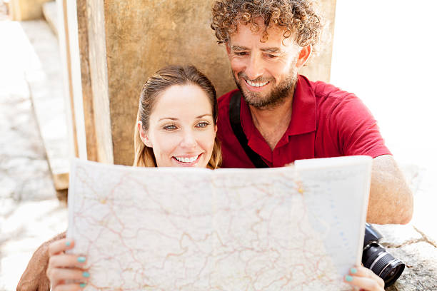 istock Adult couple reading a map 172478251