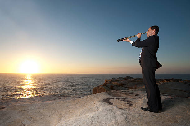 istock Businessman looking to the future with telescope 172478342