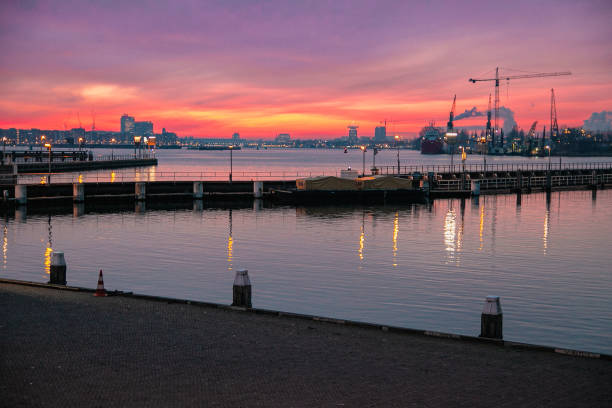 Schellingwoude, Amsterdam/The Netherlands - 27-12-2018: Locks in Schellingwoude at sunset, in the background you see the river ‘IJ’ of Amsterdam.