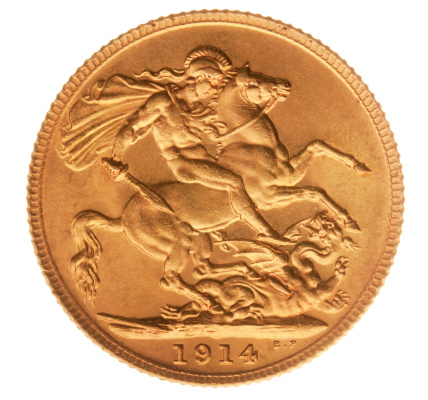 British George V solid gold half sovereign coin from 1914 showing St George slaying the dragon. The image faithfully reproduces the correct gold colour of the coin. Includes clipping path.