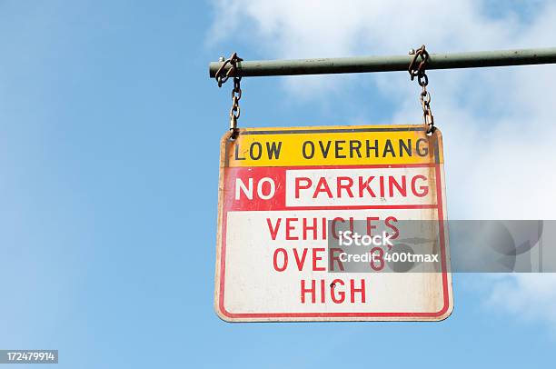 Low Overhang Sign Stock Photo - Download Image Now - Blue, Chain - Object, Day