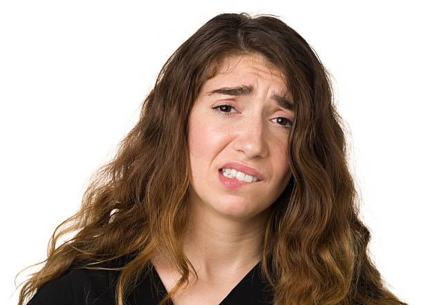 istock Nervous Young Woman Biting Lip 172480927