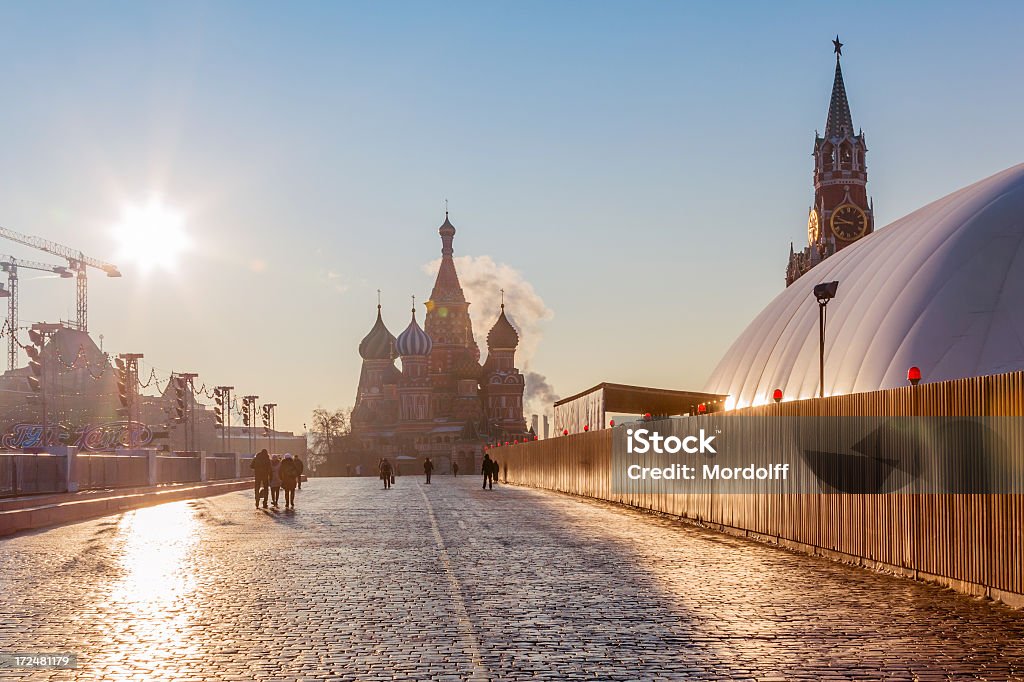 Winter morning in Red Square, Moscow Sunny view of the Pokrovsky Cathedral (St. Basil's) and the Spassky Tower at the Red Square, Moscow, Russia Architectural Dome Stock Photo