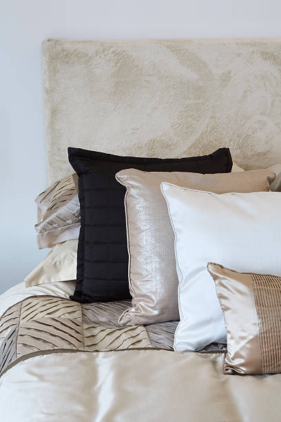 silk and satin cushions on a bed