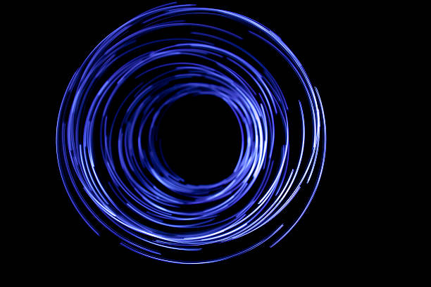 istock glowing circular blue, long exposure of creative light painting 172481453