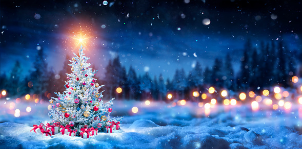 Christmas Tree And Gift Boxes On Snow In Eve Night With Bokeh Lights  - Winter Abstract Landscape