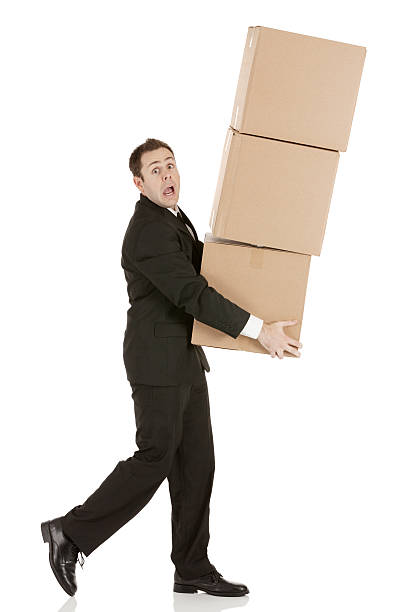istock Businessman carrying cardboard boxes 172481819