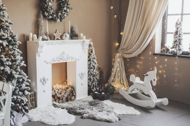 Christmas indoors interior home living room Christmas indoor interior home living room. Christmas concept. New Year’s Decor Fireplace Design stock pictures, royalty-free photos & images