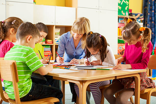 istock Teacher coloring with children. 172482159