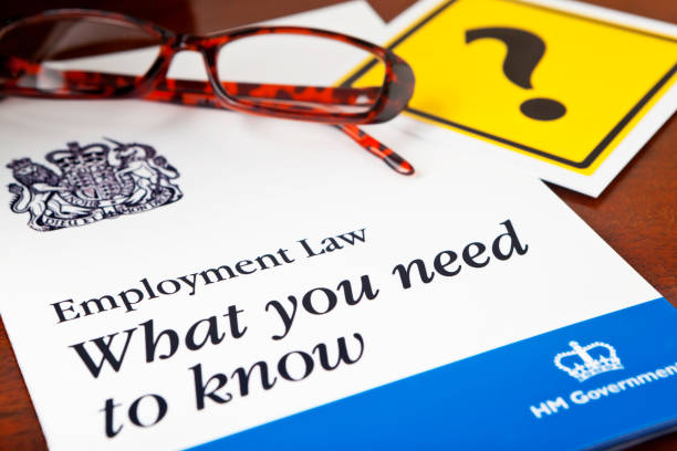 Employment Law "All businesses in the United Kingdom with employees are legally obligated to meet the obligations of Employment Rights Act 1996.  This sets out the duty of care requirements and legal obligations to which both employer and employee must commit.  This image creates a generic Employment Law leaflet, bearing the Royal Coat of Arms that appears on all UK legal statutes." hm government stock pictures, royalty-free photos & images