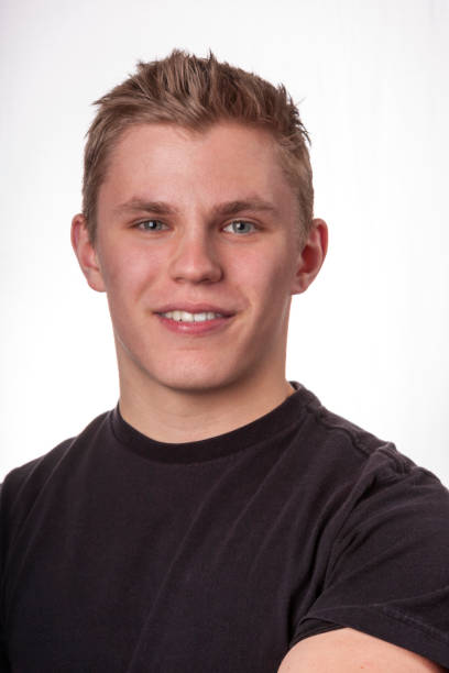istock Young adult male smiling at camera 172482477