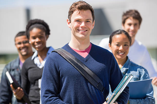 istock Male Student With Friends Standing In Background 172482608