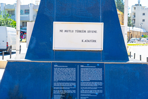 statue in honor of Kirenia gate(veteran), ataturk statue on a busy road in Nicosia.