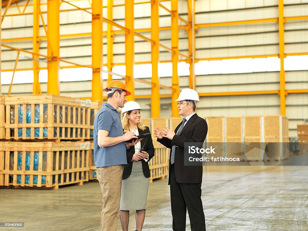 Gerente de almacén de fábrica trabajador y - Foto de stock de 40-44 años libre de derechos
