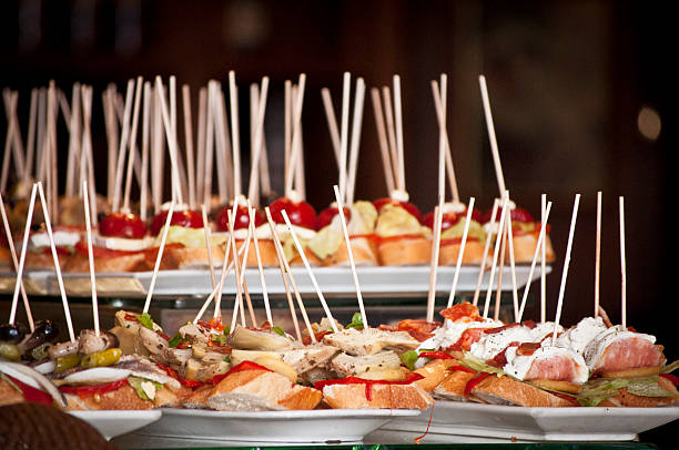 Tapas platters of fresh bread with toppings Exhibitor pinchos and tapas in a typical restaurant in Spain. almeria photos stock pictures, royalty-free photos & images