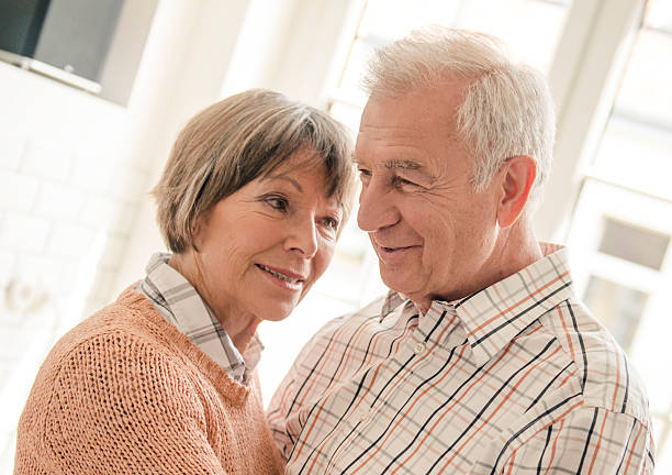 istock Seniors grandparents standing embraced 172483927